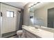Bathroom featuring a white subway tile shower, modern fixtures, and neutral tones at 109 Poinciana Ln, Deltona, FL 32738