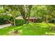 Charming single-story home nestled in lush greenery with a well-maintained lawn and cozy curb appeal at 109 Poinciana Ln, Deltona, FL 32738