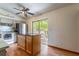 Charming kitchen with a center island, stainless steel appliances, and backyard access at 109 Poinciana Ln, Deltona, FL 32738
