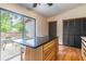 Bright kitchen area featuring island seating, stainless steel appliances, and backyard views at 109 Poinciana Ln, Deltona, FL 32738