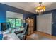 Charming home office featuring built-in desk, ample storage, and a large window with a view at 109 Poinciana Ln, Deltona, FL 32738