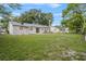 Large backyard featuring green grass and plenty of trees at 110 Rabun Ct, Sanford, FL 32773