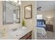 Bathroom with double mirror, vanity and open view to the bedroom at 110 Rabun Ct, Sanford, FL 32773