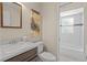 Bathroom featuring a marble vanity, toilet and a view to the tiled shower and tub at 110 Rabun Ct, Sanford, FL 32773