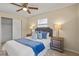 Bedroom featuring a ceiling fan, queen bed and matching nightstands at 110 Rabun Ct, Sanford, FL 32773