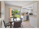 Bright dining room with a glass table, views of the backyard, and easy access to kitchen at 110 Rabun Ct, Sanford, FL 32773