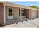 Inviting covered front porch with brick accents, minimalist landscaping, and a secure front door at 110 Rabun Ct, Sanford, FL 32773
