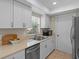 Well-lit kitchen with stainless steel appliances, double basin sink and views from the window at 110 Rabun Ct, Sanford, FL 32773