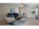 Comfortable living room with stylish furniture, tile flooring, and natural light creating a welcoming atmosphere at 110 Rabun Ct, Sanford, FL 32773