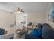 Open-concept living area with tile floors, comfortable seating, modern décor, and access to dining at 110 Rabun Ct, Sanford, FL 32773