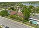 Areal view of homes featuring pools, foliage, and road with easy access to a nearby lake and recreation areas at 119 Glendale Dr, Longwood, FL 32750