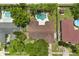 Aerial shot of a home featuring a private backyard oasis with a sparkling pool and mature landscaping at 119 Glendale Dr, Longwood, FL 32750