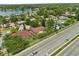 Scenic aerial view of a home nestled in a vibrant neighborhood with a tranquil lake backdrop at 119 Glendale Dr, Longwood, FL 32750