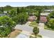 Aerial view of a home featuring lush trees and a well-maintained lawn at 119 Glendale Dr, Longwood, FL 32750