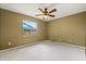 Bedroom with neutral walls, ceiling fan, and view of the backyard at 119 Glendale Dr, Longwood, FL 32750