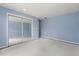 Bright blue bedroom with mirrored closet doors at 119 Glendale Dr, Longwood, FL 32750