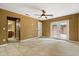 Bedroom with neutral walls and French doors leading to the backyard patio at 119 Glendale Dr, Longwood, FL 32750