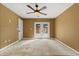 Bedroom with neutral walls and French doors leading to the backyard patio at 119 Glendale Dr, Longwood, FL 32750