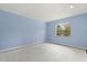Bright blue bedroom with natural light from the window at 119 Glendale Dr, Longwood, FL 32750
