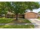 Charming single-story home with mature landscaping and a two-car garage at 119 Glendale Dr, Longwood, FL 32750