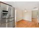 Kitchen with stainless steel refrigerator and wood floor at 119 Glendale Dr, Longwood, FL 32750
