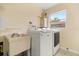 Laundry area featuring washer, dryer and utility sink at 119 Glendale Dr, Longwood, FL 32750