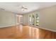 Bright and airy living room with hardwood floors and large windows at 119 Glendale Dr, Longwood, FL 32750