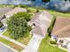 An aerial view of a home with a beautiful pond view and lush landscaping in a desirable neighborhood at 1252 Ballyshannon Pkwy, Orlando, FL 32828