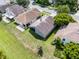 Aerial view showcasing the well-maintained backyard, screen lanai, and landscaping of this property at 1252 Ballyshannon Pkwy, Orlando, FL 32828
