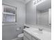 Clean bathroom featuring a toilet, vanity with sink, and shower with glass door at 1252 Ballyshannon Pkwy, Orlando, FL 32828