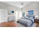 Cozy bedroom with wood floors, complemented by a large window and tasteful decor at 1252 Ballyshannon Pkwy, Orlando, FL 32828