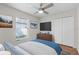 Bright bedroom with a ceiling fan, closet, and a window offering natural light at 1252 Ballyshannon Pkwy, Orlando, FL 32828