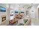 Bright living room with neutral walls, tile flooring, and a cozy fireplace; features elegant furnishings and decor at 1252 Ballyshannon Pkwy, Orlando, FL 32828