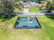Nice fenced-in community playground area with mature trees and green grass at 1252 Ballyshannon Pkwy, Orlando, FL 32828