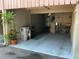 Attached carport featuring ample space for parking and extra storage with gray concrete flooring at 1409 Oak Pl # F, Apopka, FL 32712