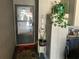 Inviting entryway with a storm door and decorative plants; a welcoming scene at 1409 Oak Pl # F, Apopka, FL 32712