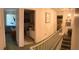 Bright hallway with a view into the bathroom and bedroom, plus stairway at 1409 Oak Pl # F, Apopka, FL 32712