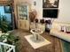 Cozy living room featuring a television, comfortable seating, and tasteful decor at 1409 Oak Pl # F, Apopka, FL 32712