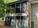 Two-story home with an enclosed screen patio for outdoor enjoyment at 1409 Oak Pl # F, Apopka, FL 32712