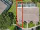 Aerial view of the townhome with a focus on its roof and the private pools at 1521 Tranquil Ave, Clermont, FL 34714