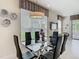Contemporary dining room with a glass table and stylish black chairs at 1521 Tranquil Ave, Clermont, FL 34714