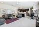 Open-concept living space with a modern kitchen and comfortable lounge area at 1521 Tranquil Ave, Clermont, FL 34714