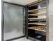 A wine refrigerator with wooden racks and a temperature control panel at 1521 Tranquil Ave, Clermont, FL 34714