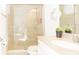Bright bathroom with a glass-enclosed shower and granite vanity top at 1545 Fairview Cir, Reunion, FL 34747