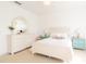 Bright bedroom with a white dresser and bedside table at 1545 Fairview Cir, Reunion, FL 34747
