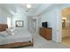 Light and airy bedroom featuring a decorative tray ceiling at 1545 Fairview Cir, Reunion, FL 34747