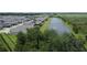 Aerial view of community homes backing onto a serene pond at 1774 Pasture Loop, Oviedo, FL 32765