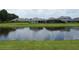Backyards of beautiful homes bordering on a relaxing pond view at 1774 Pasture Loop, Oviedo, FL 32765