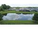 The backyard view offers access to a calming pond at 1774 Pasture Loop, Oviedo, FL 32765
