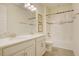 Bathroom features a double vanity, white cabinets, and shower-tub combo at 1774 Pasture Loop, Oviedo, FL 32765